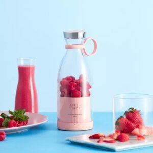 USB-powered portable blender blending fruits into a smoothie.