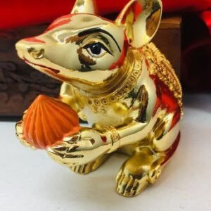 Side profile of Ganpati mouse idol in gold, showing traditional design