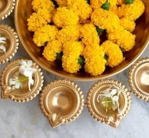"Indian festive diya decor centerpiece in floral shape"