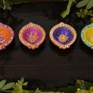 Decorative clay diyas with intricate detailing for Puja rituals