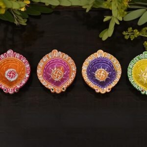 Decorative terracotta diyas with colorful designs for Diwali