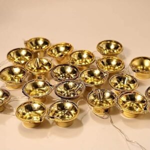 Close-up of LED fairy lights on a golden diya toran.